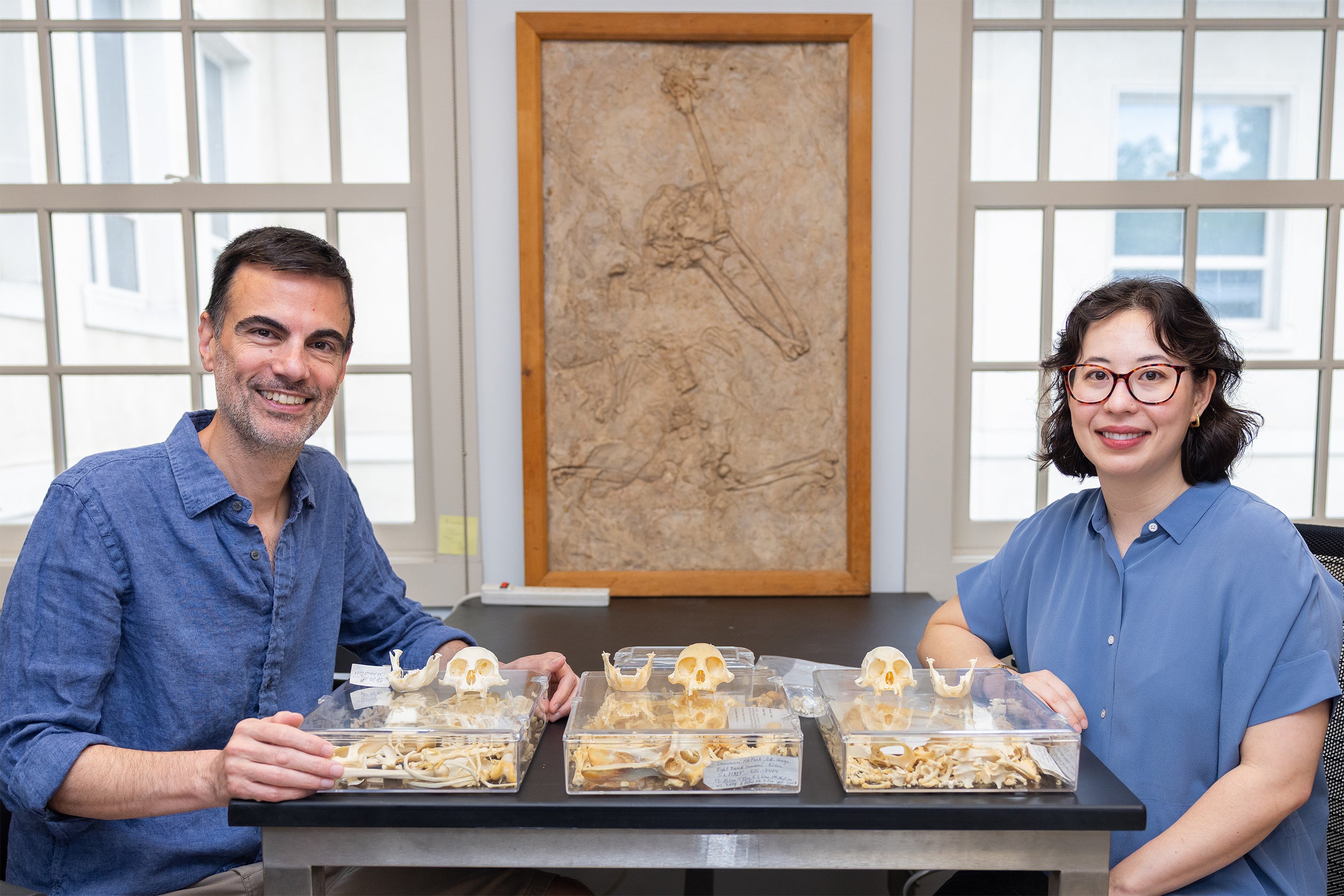 Eric Sargis and Julia Arenson with monkey skulls