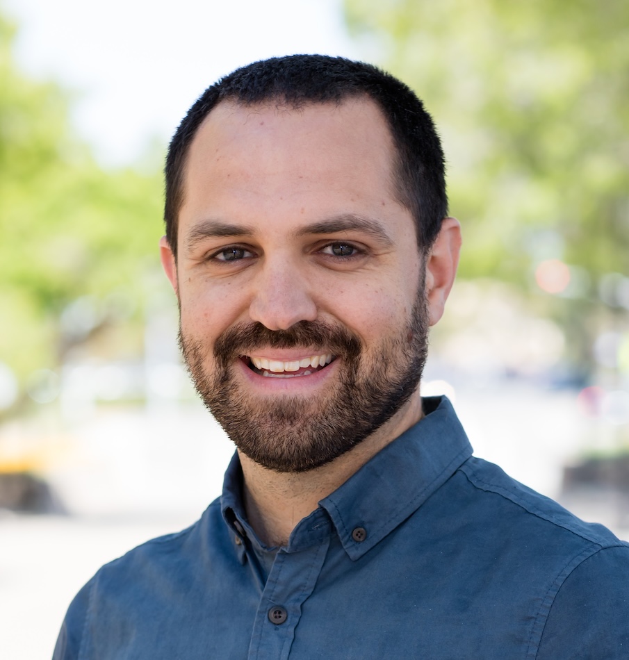 Portrait photo of Dr. Madden. He is looking at camera and smiling