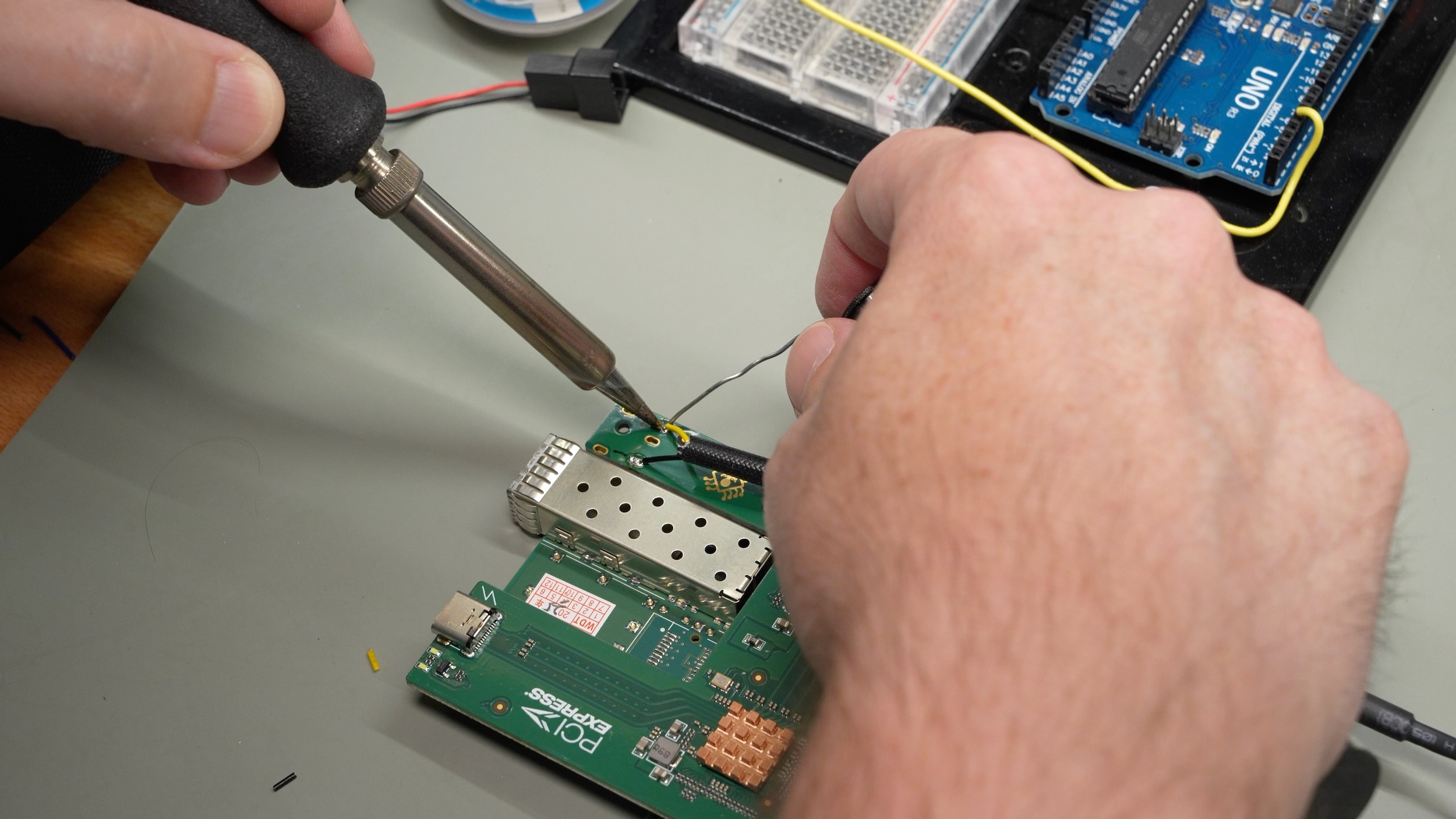 Soldering the fan connector on the NIC adapter board for 5V power