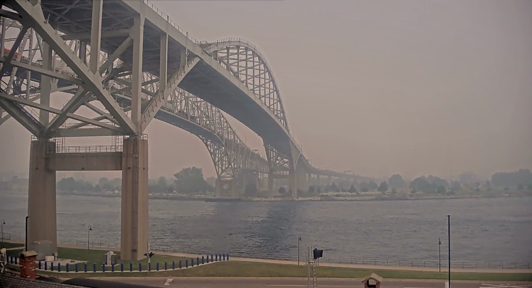 Bridge heading into the smokey landscape.
