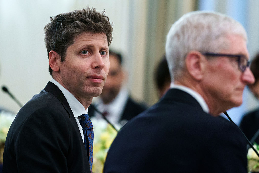 Sam Altman, chief executive officer of OpenAI Inc., left, and Tim Cook, chief executive officer of Apple Inc.