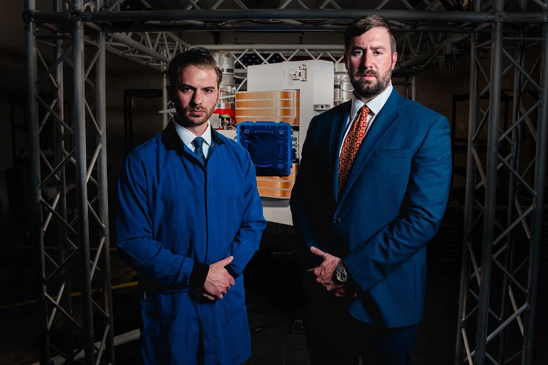 CTO Robert Mendelsohn (left) and CEO Eric Olszewski (right) stand before Fortitude, Actinide's second-generation calutron, estimated to deliver roughly half the throughput of the entire U.S. federal calutron fleet in a single machine.