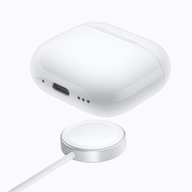 AirPods 5 with Wireless Charging Case are pictured above a charger.