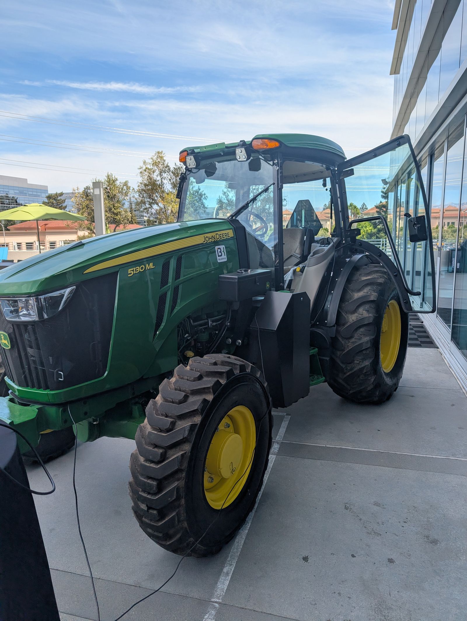 John Deere tractor plugged in with a cord