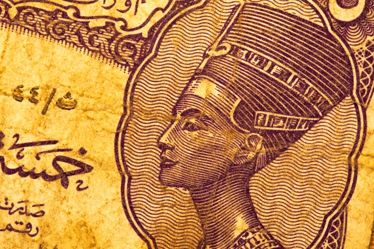 Close-up of old Egyptian bank note showing the depiction of Queen Nefertiti.